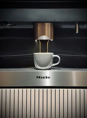 a coffee maker is making a cup of coffee at AWolf in a healthy NEW home in Herentals