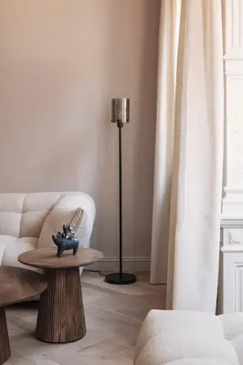 a living room with a couch and a table at Zurenborg Suites in Antwerp