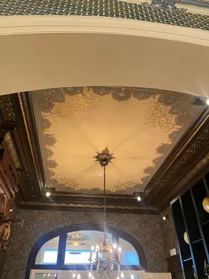a ceiling with a chandelier in a room at The Museum - Au Lit, Jérôme! in Antwerp