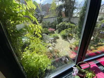 a view of a garden from a window at The Museum - Au Lit, Jérôme! in Antwerp