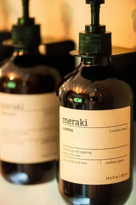 two bottles of vinegar sitting on top of a table at ZenCabin - Luxe en Wellness in de natuur in Hulshout