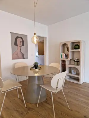 a dining room with a table and chairs at Fully equiped 100 m2 appt with the perfect location in Vilvoorde