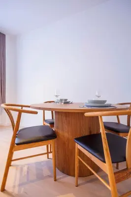 a table and chairs with plates on top of it at Märch - Mechelen Goat 14 in Mechelen