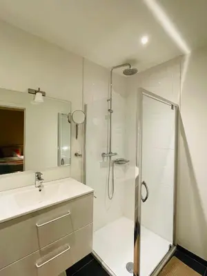 a bathroom with a shower and a sink at Studio Intensity in Antwerp
