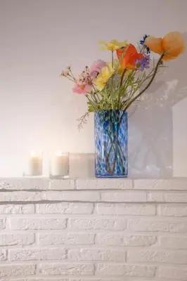 a vase filled with flowers sitting on a wall at Chic 3-BR Oasis in Ghent - Stylish Interiors in Ghent