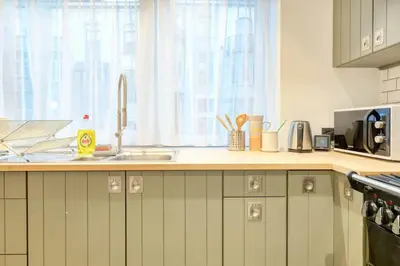 a kitchen with a sink and a counter top at Chic 3-BR Oasis in Ghent - Stylish Interiors in Ghent