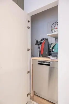 a kitchen with a washer and dryer in a closet at Chic 3-BR Oasis in Ghent - Stylish Interiors in Ghent