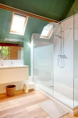 a bathroom with a glass shower and a sink at Cozy Retreat with Sauna near Gent-St-Pieters in Ghent