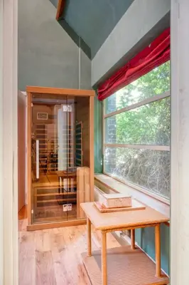 a room with a table and a large window at Cozy Retreat with Sauna near Gent-St-Pieters in Ghent