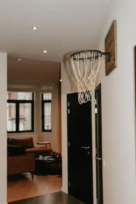 a basketball hoop hanging from a wall in a living room at Modern home near Ghent - Easy Access, Ideal Living in Ghent