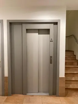 an elevator door in a building with stairs at Studio Tintin in Brussels