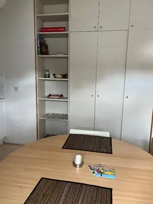 a wooden table with a laptop on top of it at Studio Tintin in Brussels