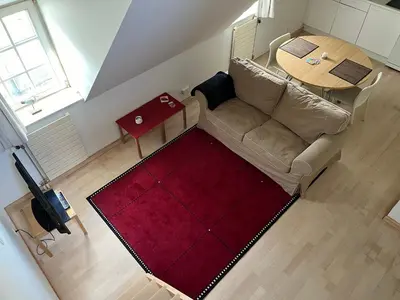 an overhead view of a living room with a couch and a table at Studio Tintin in Brussels