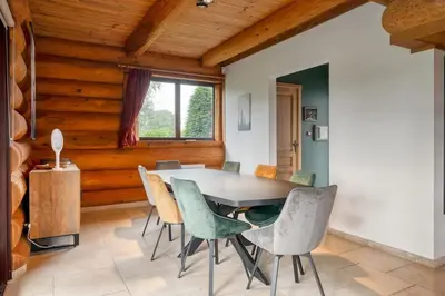 a dining room with a table and chairs at Cozy 4-Bedroom Chalet with Outdoor Spa in Zottegem in Zottegem