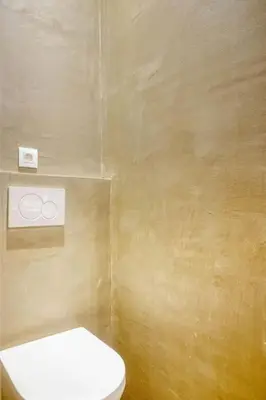a bathroom with a white toilet in a room at Cozy Ghent Studio for 4 Guests in Ghent