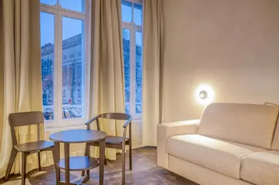 a living room with a couch and chairs and a table at Chic 3P Retreat in Heart of Ghent in Ghent
