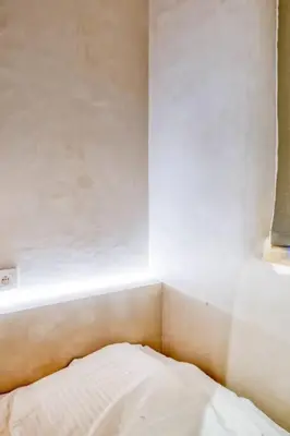 a bedroom with a white bed and a window at Chic 3P Retreat in Heart of Ghent in Ghent
