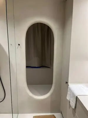 a small bathroom with a shower with a mirror at Chic 3P Retreat in Heart of Ghent in Ghent