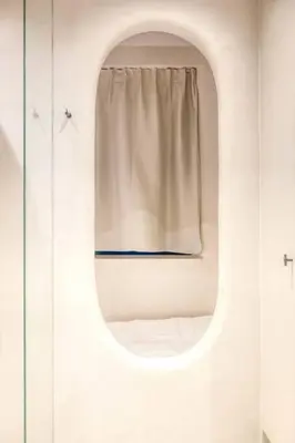 a window in a white room with a curtain at Chic 3P Retreat in Heart of Ghent in Ghent