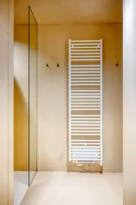 a bathroom with a window and a glass shower at Charming Attic Studio in Ghent in Ghent