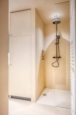 a room with a glass door and a chandelier at Charming Attic Studio in Ghent in Ghent