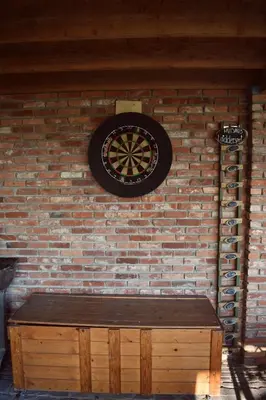 a wall with a clock on a brick wall at Vakantiewoning de Huismus in Oud-Turnhout