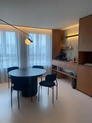 a kitchen and dining room with a table and chairs at Studio Conda in Antwerp