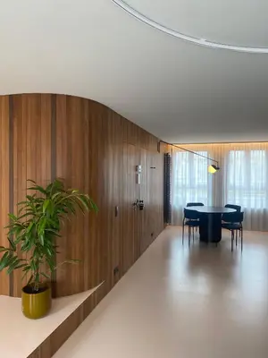 a dining room with a table and a potted plant at Studio Conda in Antwerp