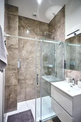 a bathroom with a shower and a sink at Urban Chic Apartment in the Heart of Mechelen in Mechelen