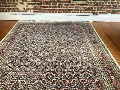 a rug on the floor in front of a brick wall at Nice flat near Brussels in Dilbeek
