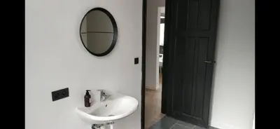 a bathroom with a sink and a mirror on the wall at Bruxelles midi flat in Brussels
