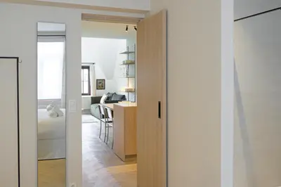 a room with a door leading into a bedroom at SHWAY - The Printing Press in Antwerp