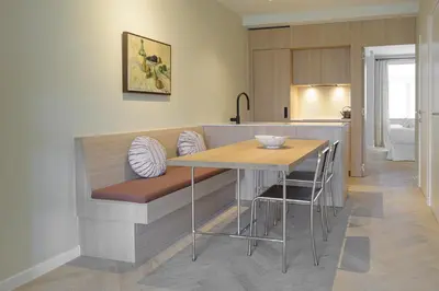 a kitchen with a table and some chairs at SHWAY - The Printing Press in Antwerp