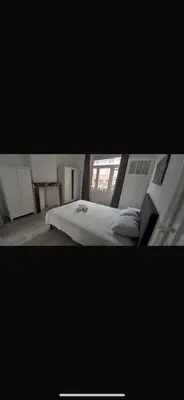 a bedroom with a bed and a window at Brussels city center apartment in Brussels