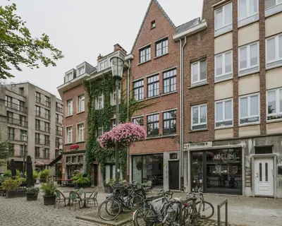 a group of bikes parked in front of a building at SHWAY - The Book Binder in Antwerp