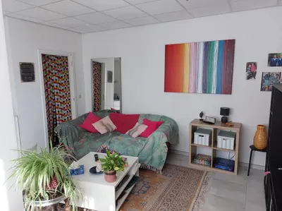 a living room with a couch and a table at LUX Appartment in BXL Center in Brussels