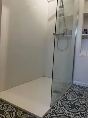 a shower with a glass door in a bathroom at Melkhuisje in Dendermonde