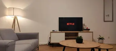 a living room with a couch and a tv at Two Bedroom Apartment with Amazing View in Center in Brussels