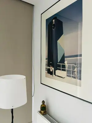 a picture of a boat is hanging on a wall at Surplombant louisa in Brussels