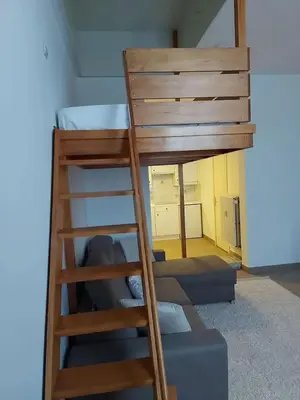 a bunk bed with a ladder in a room at Charming Apartment in Haren, Brussels - 40 sqm of Comfort in Brussels