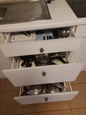 a drawer in a kitchen with pots and pans at Charming Apartment in Haren, Brussels - 40 sqm of Comfort in Brussels
