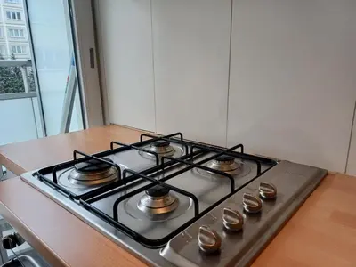 a stove top oven sitting on top of a kitchen counter at Prime Nest Cozy Studio EU Quarter in Brussels