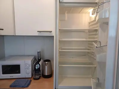 a refrigerator with a toaster oven and a microwave at Prime Nest Cozy Studio EU Quarter in Brussels