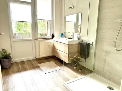 a bathroom with a sink and a shower at Magnifique appartement spacieux in Brussels
