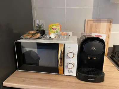 a microwave oven sitting on top of a counter at La belle étoile de Bruxelles in Brussels