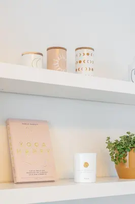 a shelf with a book and some vases at Your serenity bubble - Brussels center in Brussels