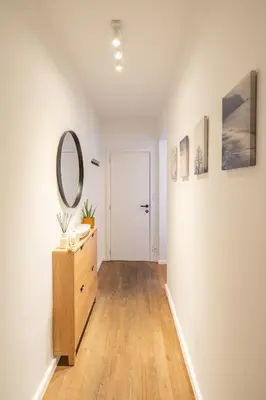 a bathroom with a dresser and a mirror on a wall at Your serenity bubble - Brussels center in Brussels