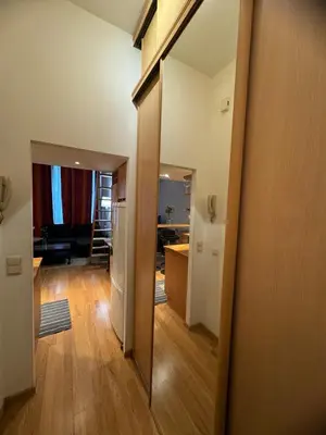 a room with a hallway with a kitchen and a living room at Lisa appartement Brussels in Brussels