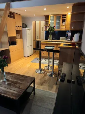 a kitchen with a table and a counter top at Lisa appartement Brussels in Brussels