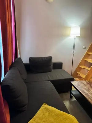 a living room with a couch and a table at Lisa appartement Brussels in Brussels